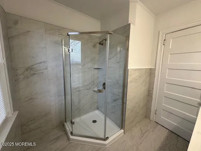 a bathroom with a shower and a sink