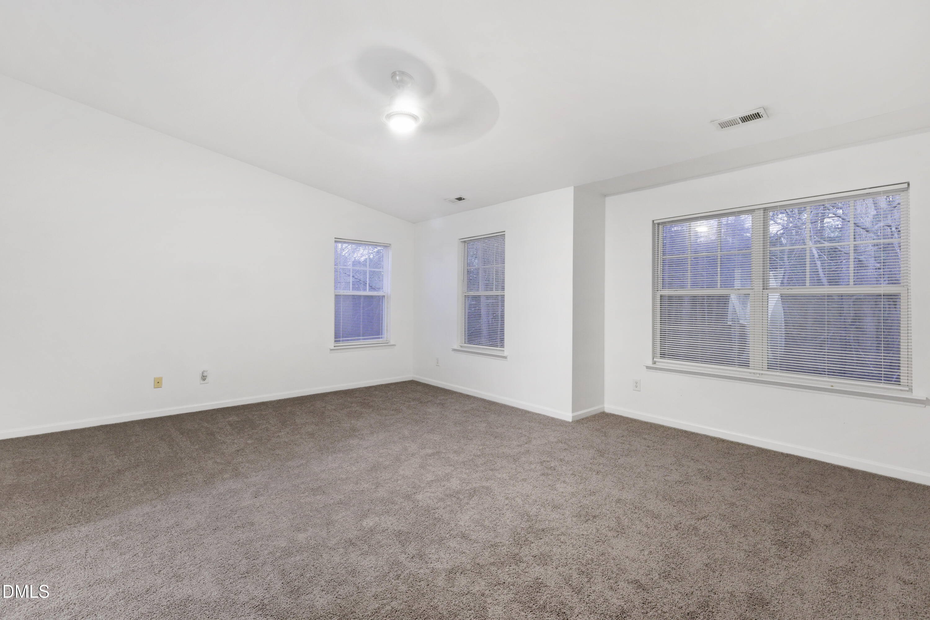 11710 Mezzanine Drive, Unit 101 Raleigh, NC 27614 - Photo 15 of 29 an empty room with windows