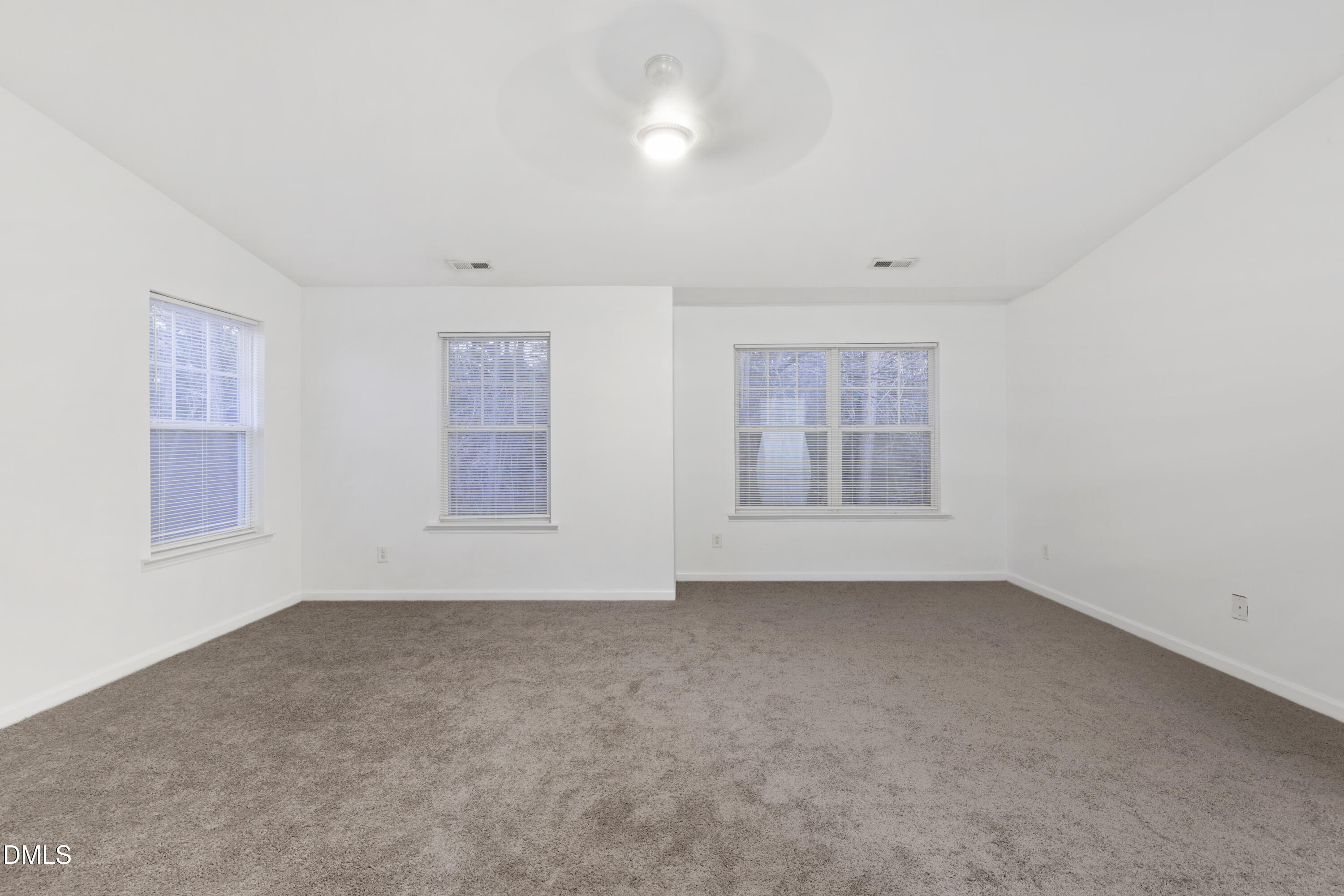 11710 Mezzanine Drive, Unit 101 Raleigh, NC 27614 - Photo 16 of 29 a view of an empty room with a window