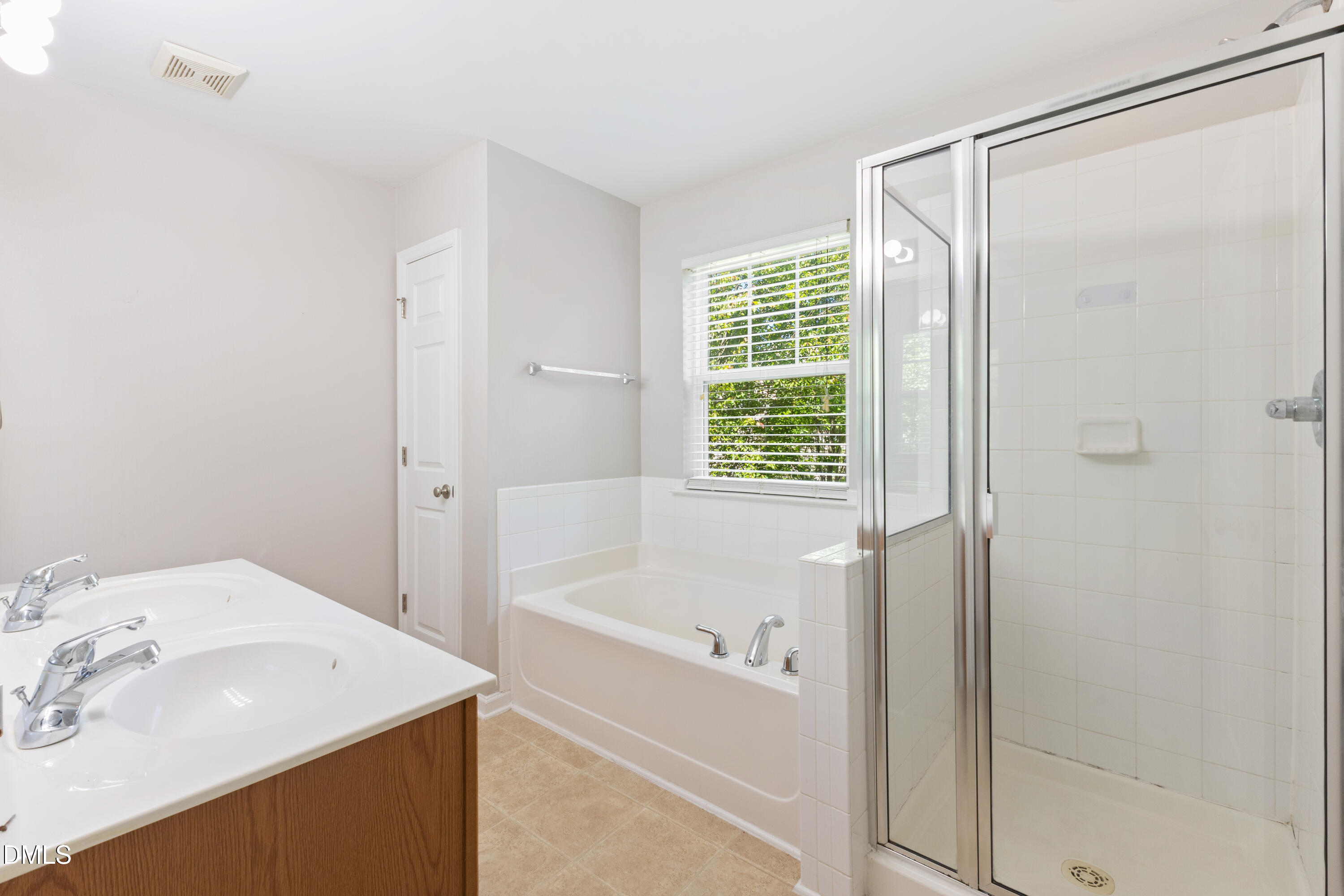 11710 Mezzanine Drive, Unit 101 Raleigh, NC 27614 - Photo 18 of 29 a bathroom with a bathtub and a sink