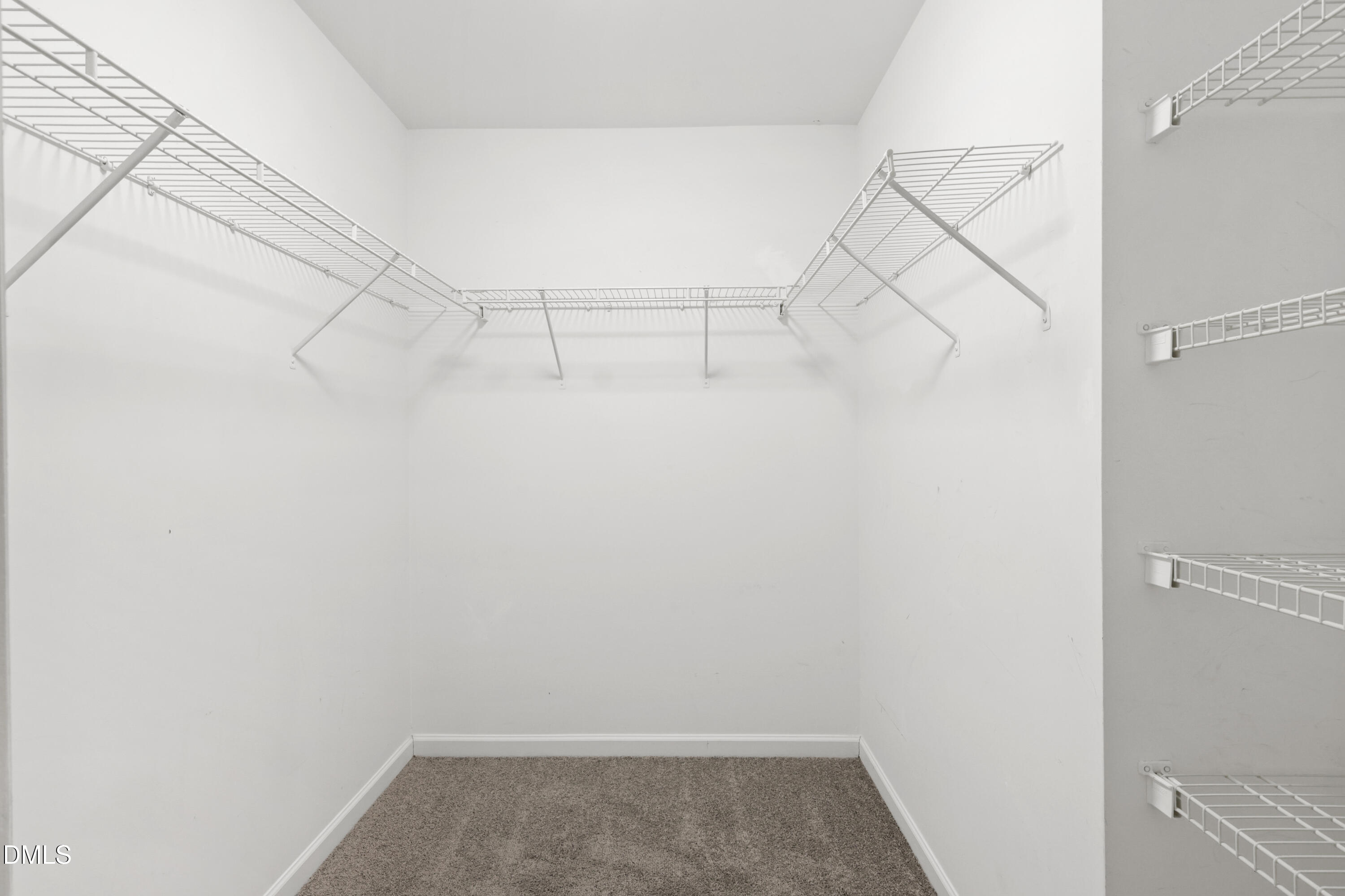 11710 Mezzanine Drive, Unit 101 Raleigh, NC 27614 - Photo 29 of 29 a view of a room with racks on the wall