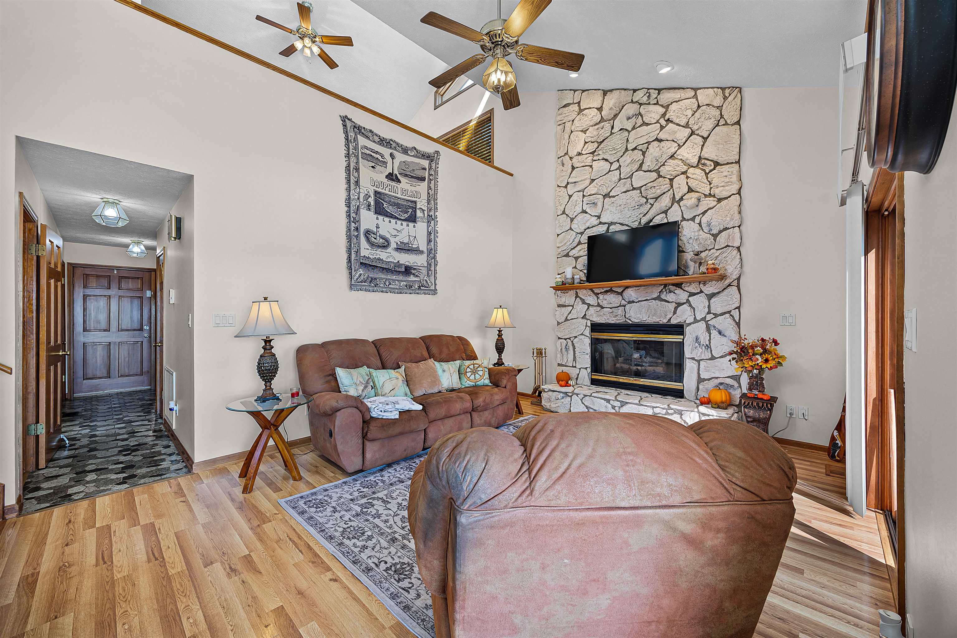 1515 Riverside Lane Adamsville, TN 38310 - Photo 11 of 34 a living room with furniture and a fireplace