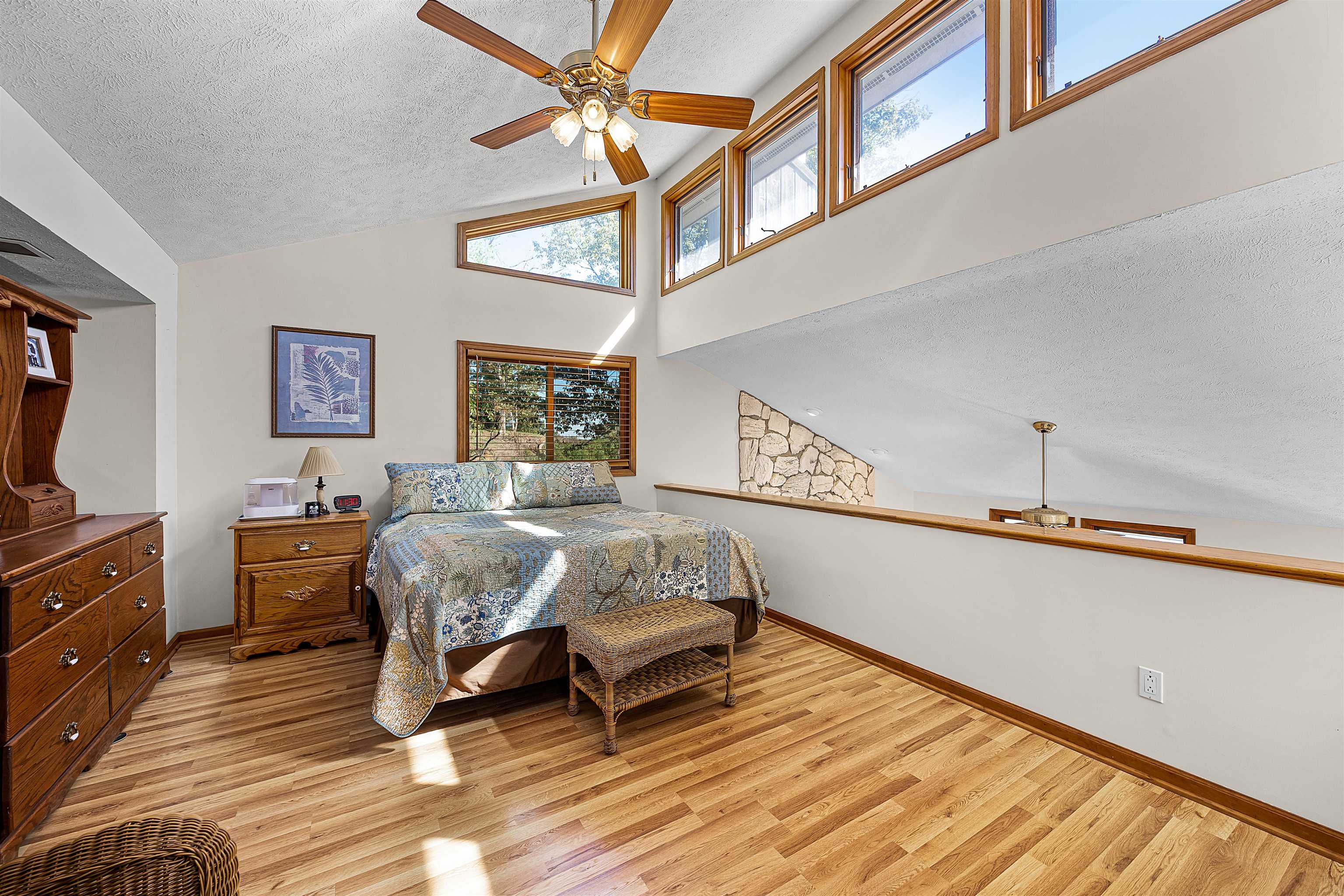 1515 Riverside Lane Adamsville, TN 38310 - Photo 18 of 34 a bedroom with a bed dresser and a window