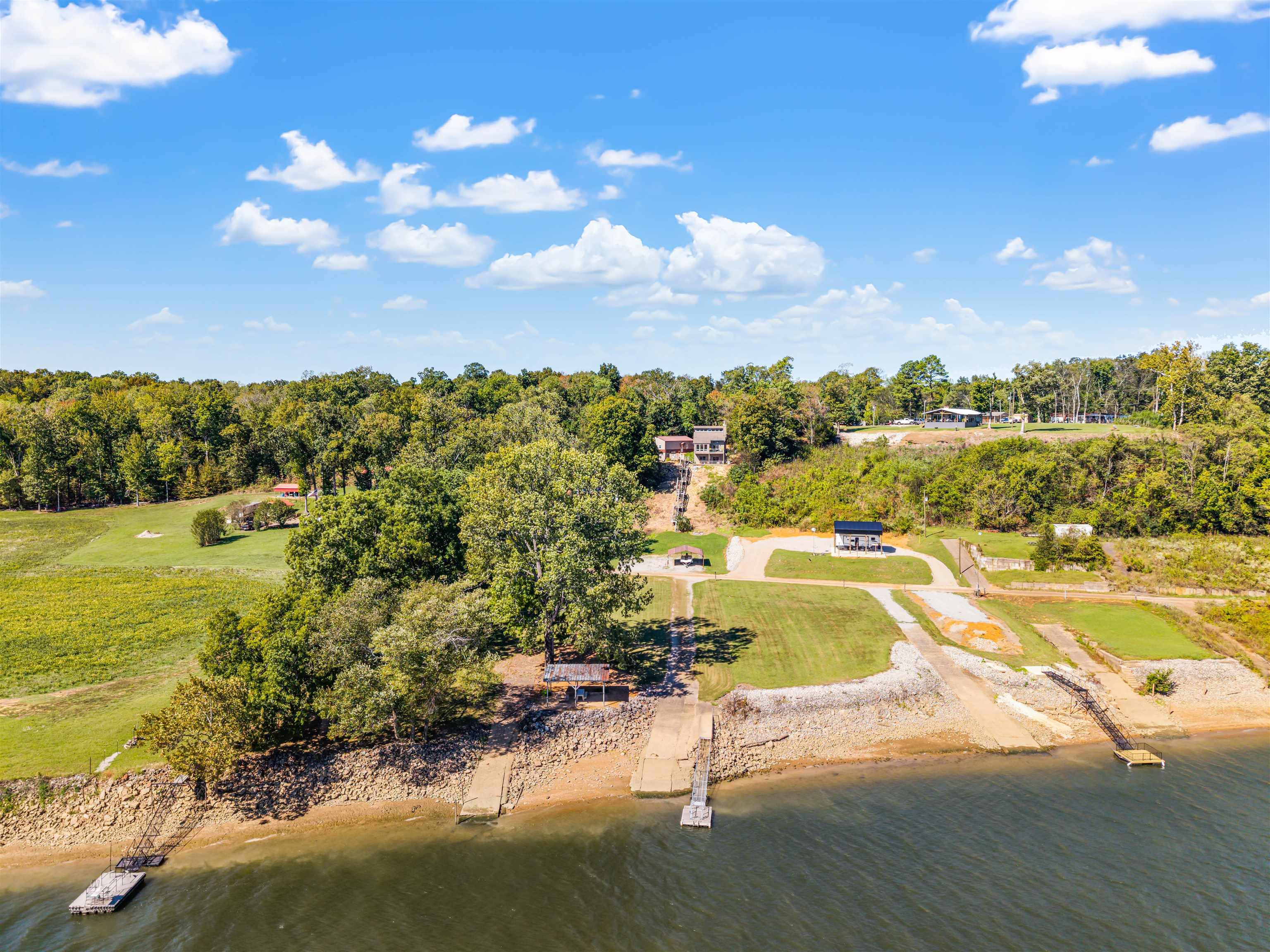 1515 Riverside Lane Adamsville, TN 38310 - Photo 2 of 34 Aerial view of a large body of water and a tree filled landscape
