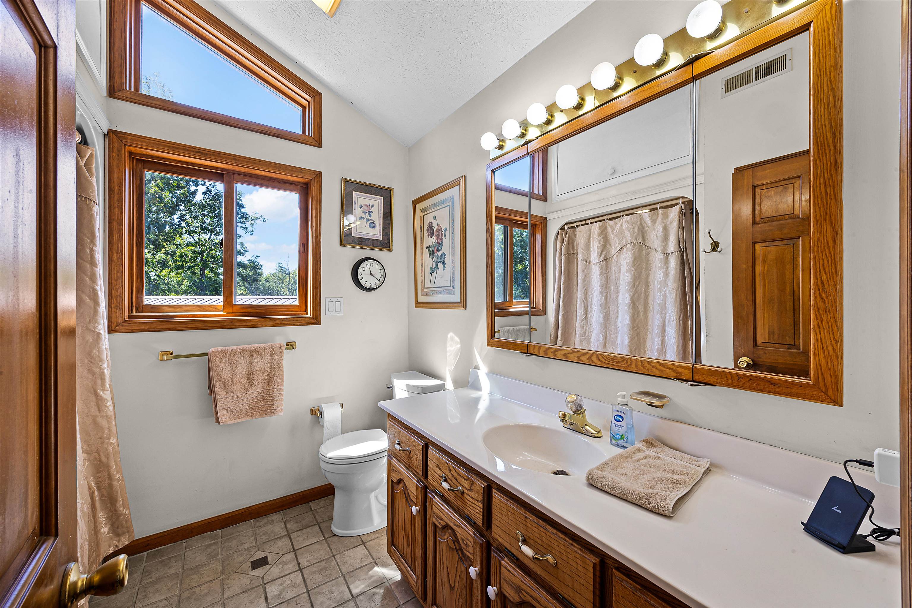 1515 Riverside Lane Adamsville, TN 38310 - Photo 21 of 34 a bathroom with a sink a toilet and a mirror