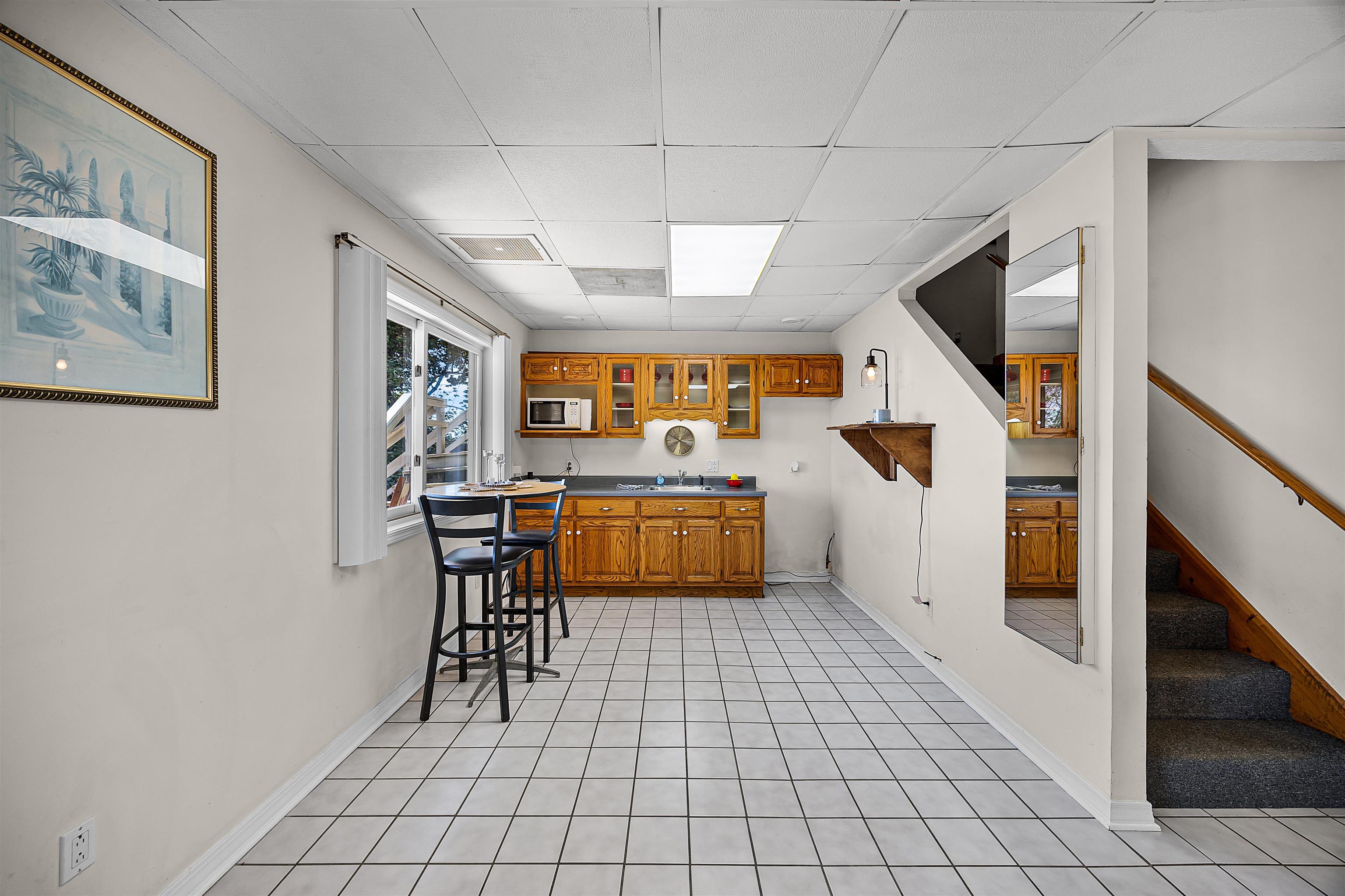 1515 Riverside Lane Adamsville, TN 38310 - Photo 25 of 34 a kitchen with a sink a counter top space and cabinets