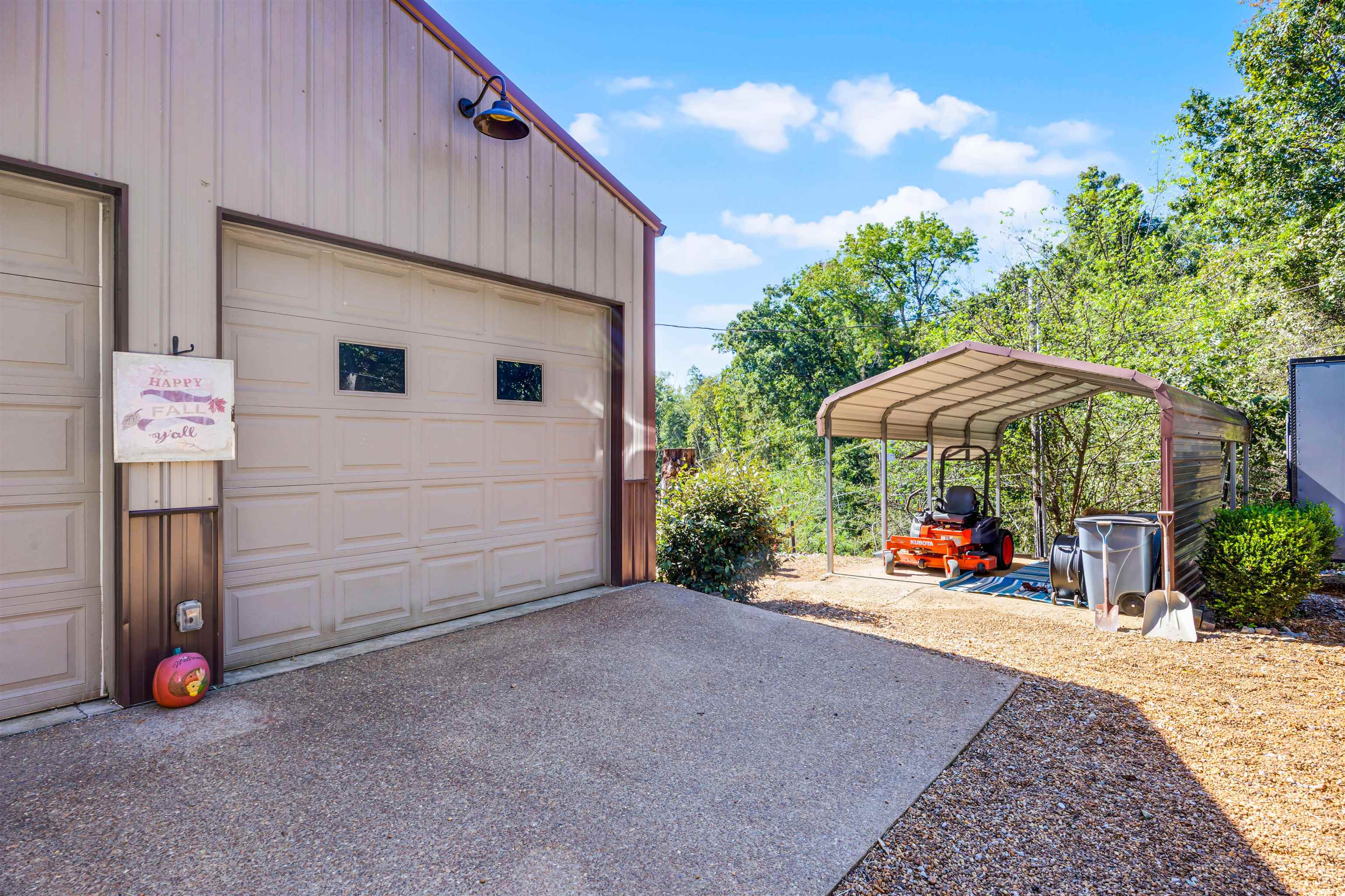 1515 Riverside Lane Adamsville, TN 38310 - Photo 30 of 34 an outdoor space with furniture and umbrella