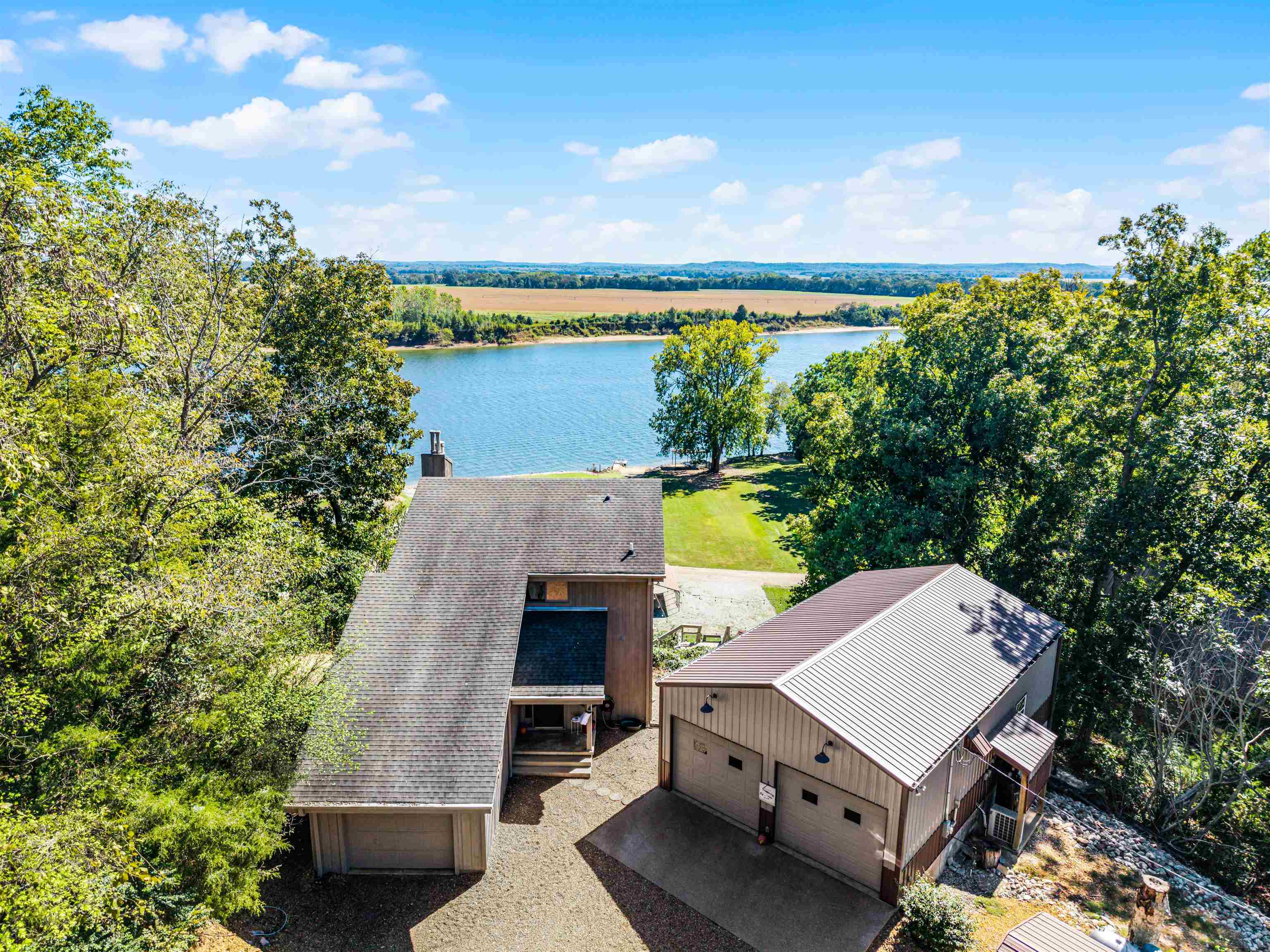 1515 Riverside Lane Adamsville, TN 38310 - Photo 3 of 34 an aerial view of a house with balcony and outdoor space