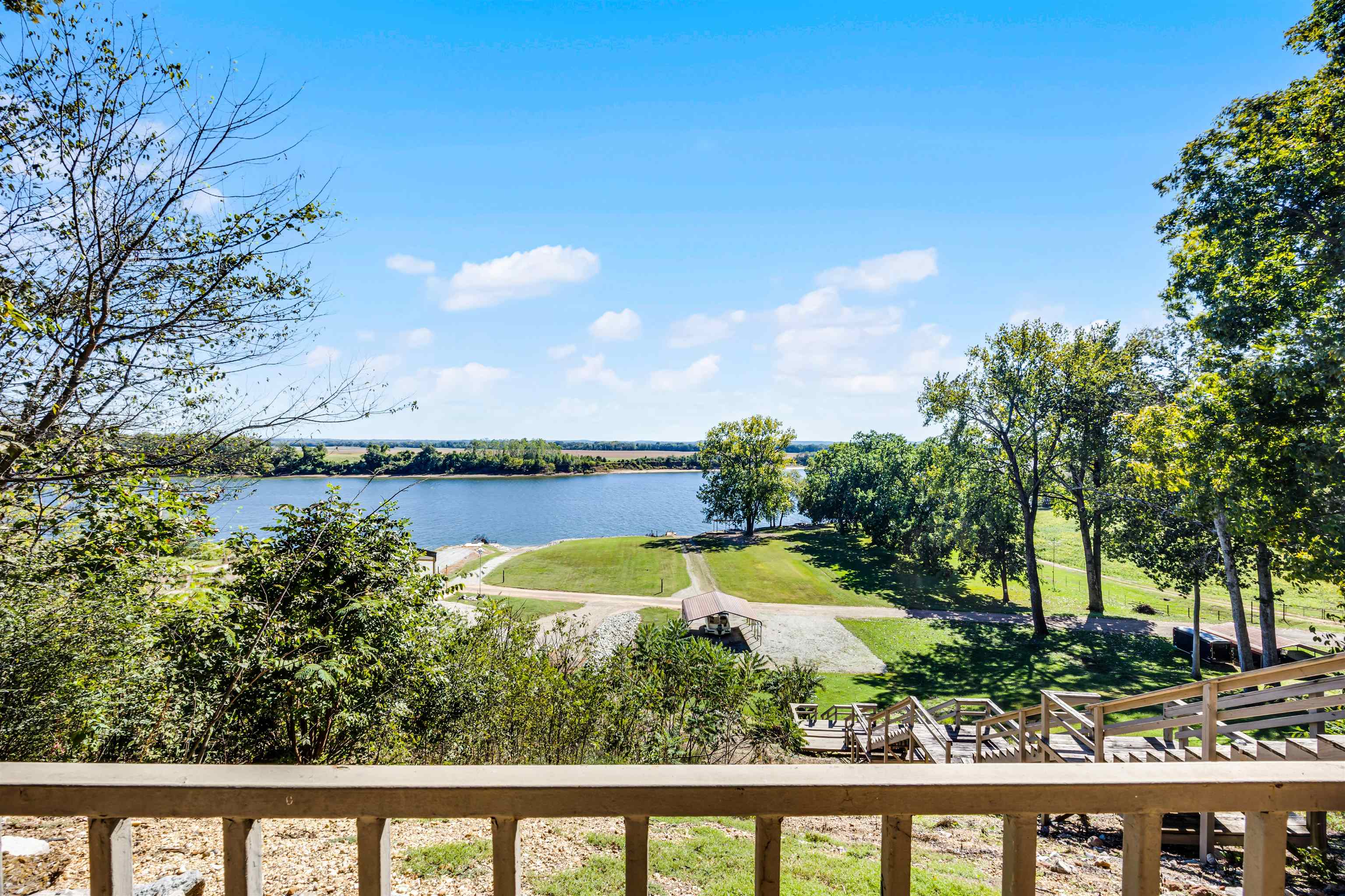 1515 Riverside Lane Adamsville, TN 38310 - Photo 5 of 34 a view of a lake with a mountain in the background
