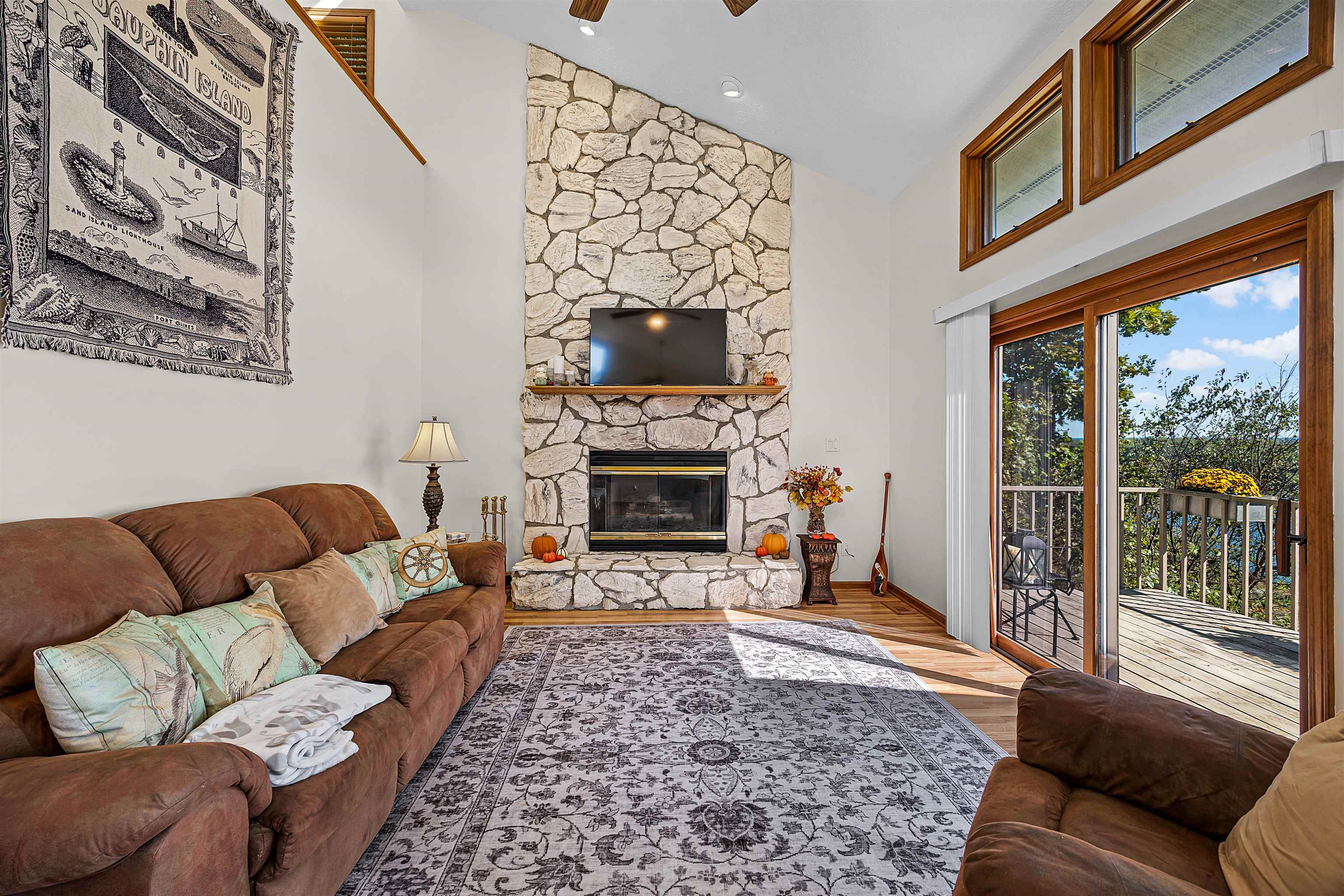 1515 Riverside Lane Adamsville, TN 38310 - Photo 10 of 34 a living room with furniture a flat screen tv and a fireplace