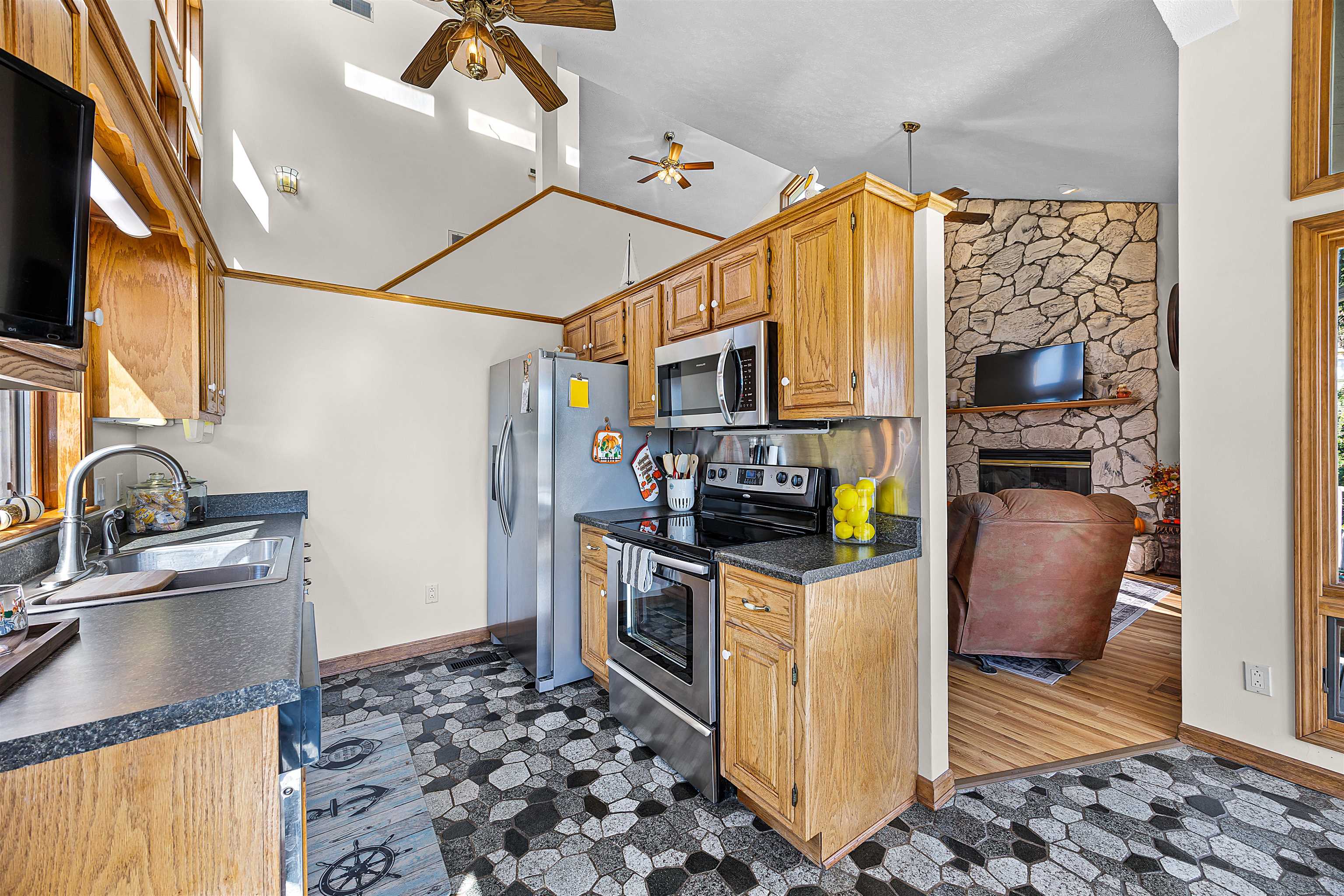 1515 Riverside Lane Adamsville, TN 38310 - Photo 10 of 34 a kitchen with stainless steel appliances granite countertop a refrigerator and a stove top oven