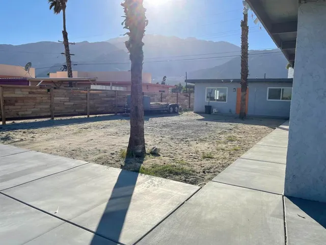 a view of a backyard of the house