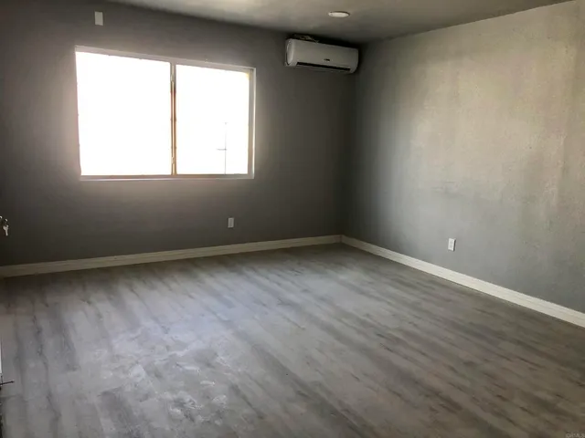 wooden floor and window in an empty room