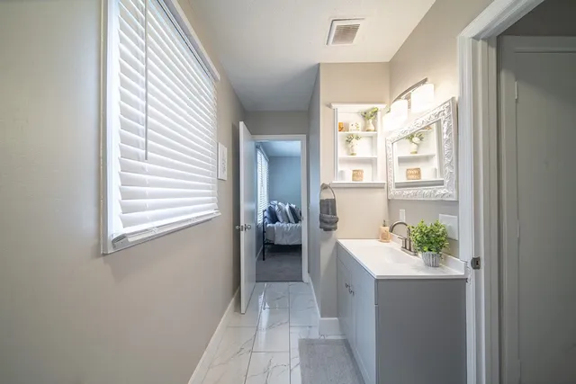 a white toilet sitting next to a window