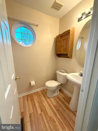 a large kitchen with a stove top oven a sink dishwasher and a refrigerator