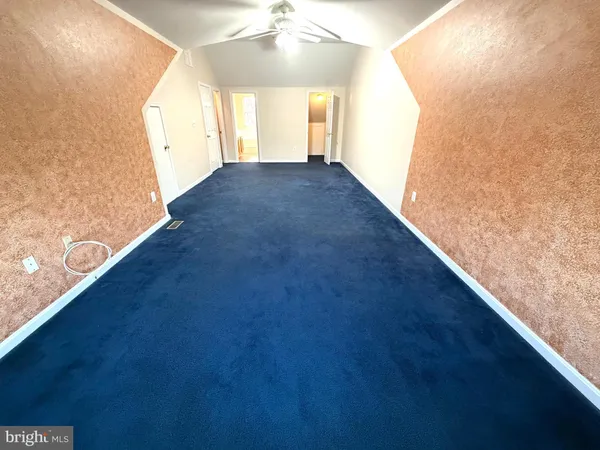a bathroom with a bathtub and window