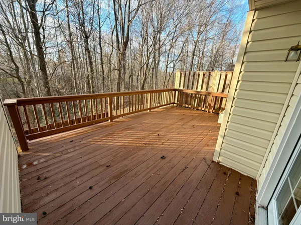 a view of balcony with wooden floor