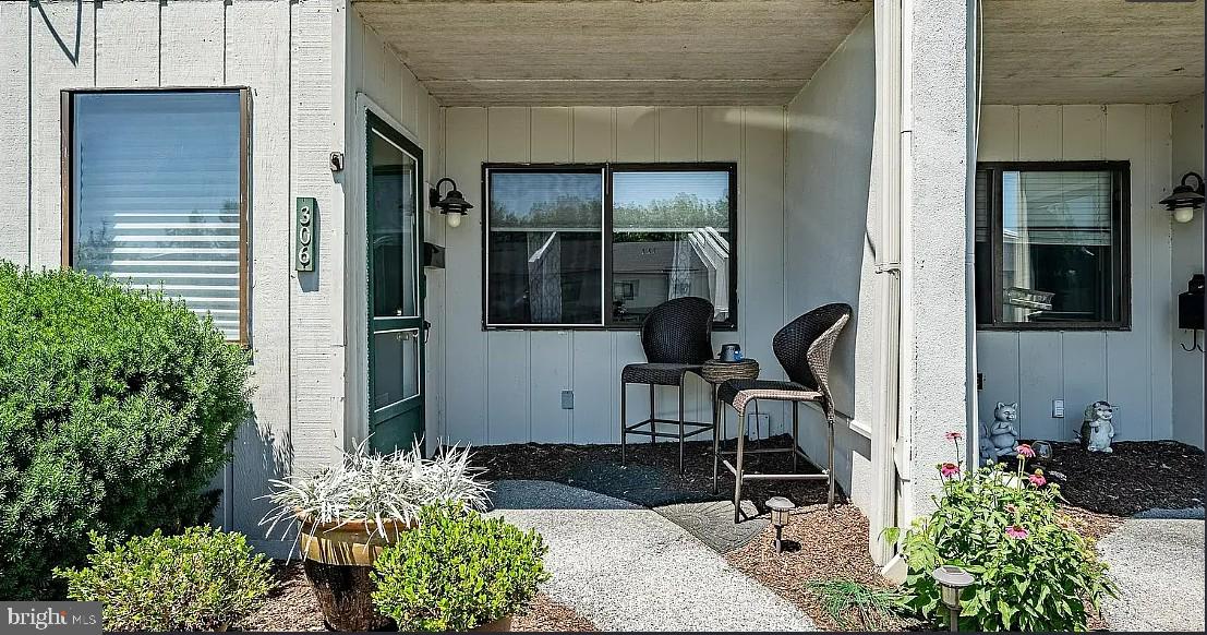 306 Summit House, Unit 306 West Chester, PA 19382 - Photo 3 of 17 a front view of a house with outdoor seating