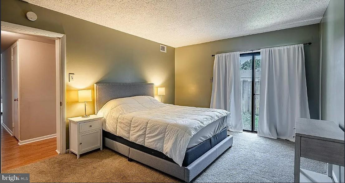 306 Summit House, Unit 306 West Chester, PA 19382 - Photo 10 of 17 a bedroom with a bed and a window