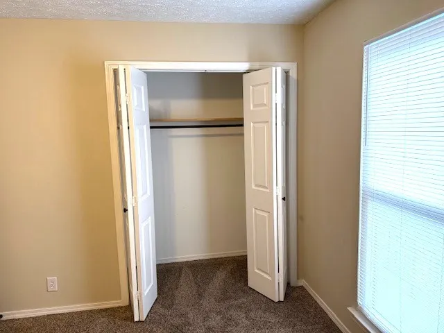 a bathroom with a toilet and a bathtub