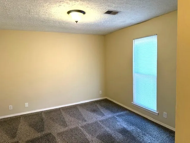an empty room with a wooden door
