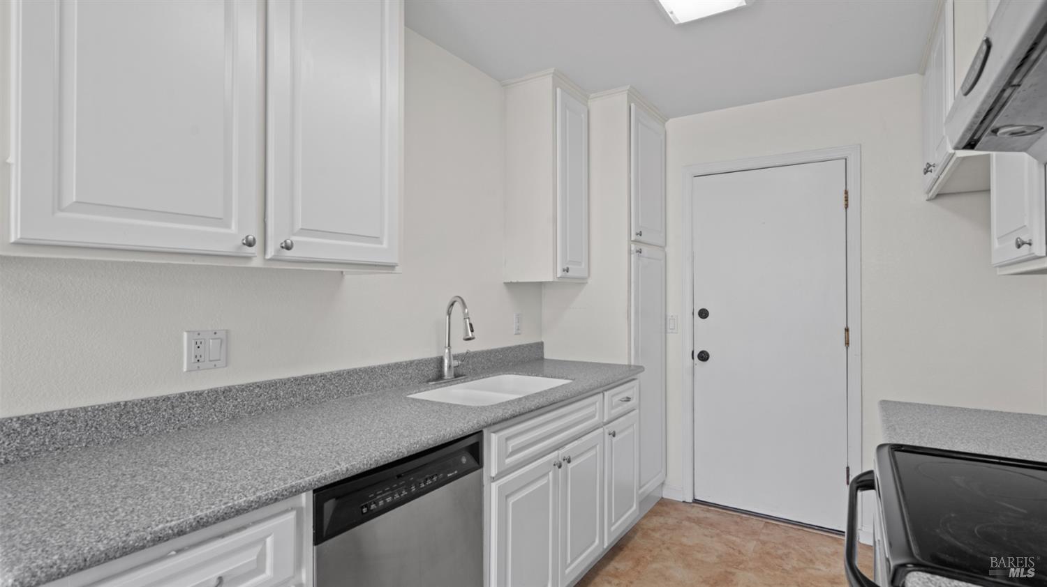 2306 Maher Drive Santa Rosa, CA 95405 - Photo 13 of 28 a kitchen with a sink and cabinets