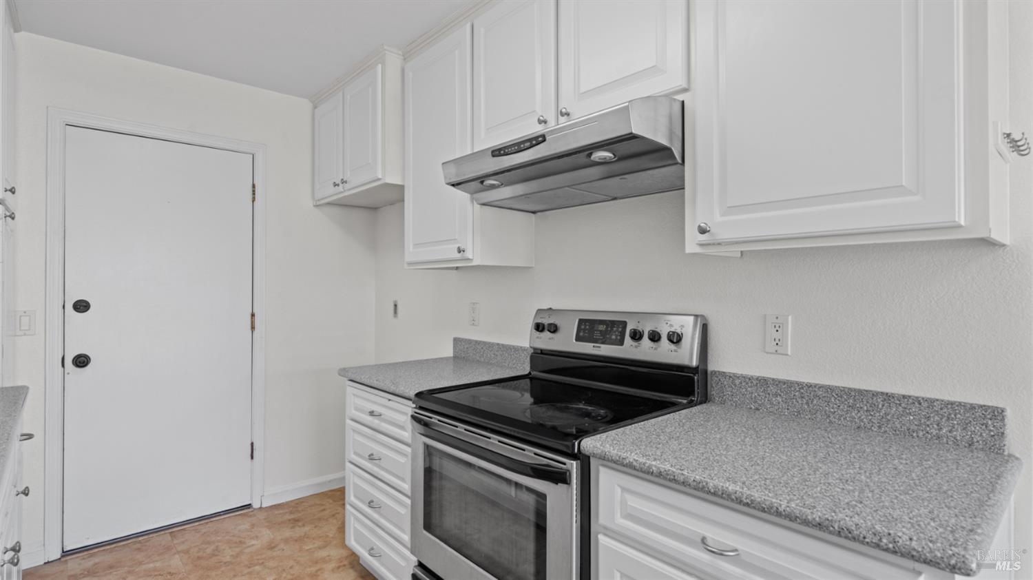 2306 Maher Drive Santa Rosa, CA 95405 - Photo 14 of 28 a kitchen with stainless steel appliances granite countertop white cabinets and a stove