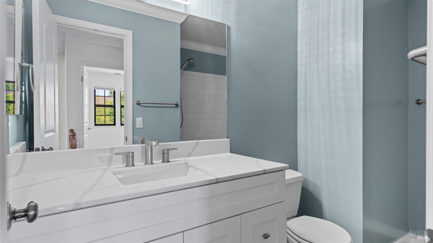 2306 Maher Drive Santa Rosa, CA 95405 - Photo 17 of 28 a bathroom with a sink toilet and mirror