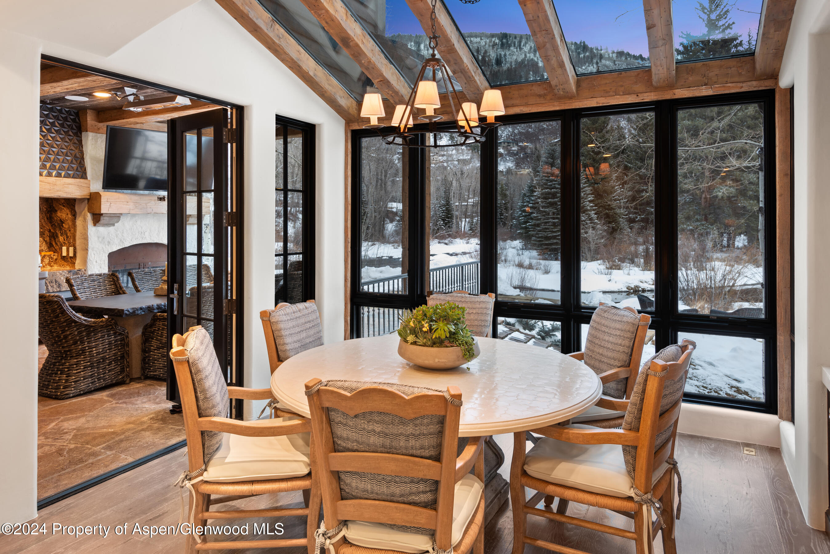 1449 Crystal Lake Road Aspen, CO 81611 - Photo 26 of 82 a dining room with furniture and large windows
