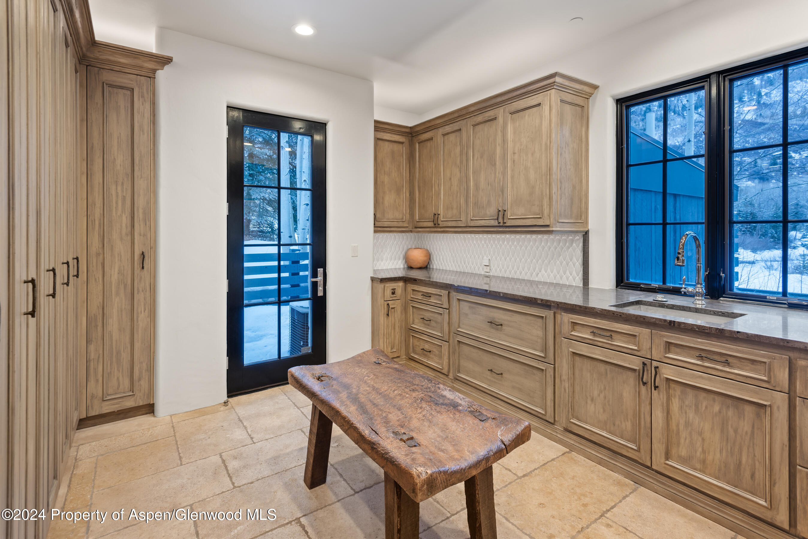 1449 Crystal Lake Road Aspen, CO 81611 - Photo 31 of 82 a kitchen with granite countertop cabinets and window