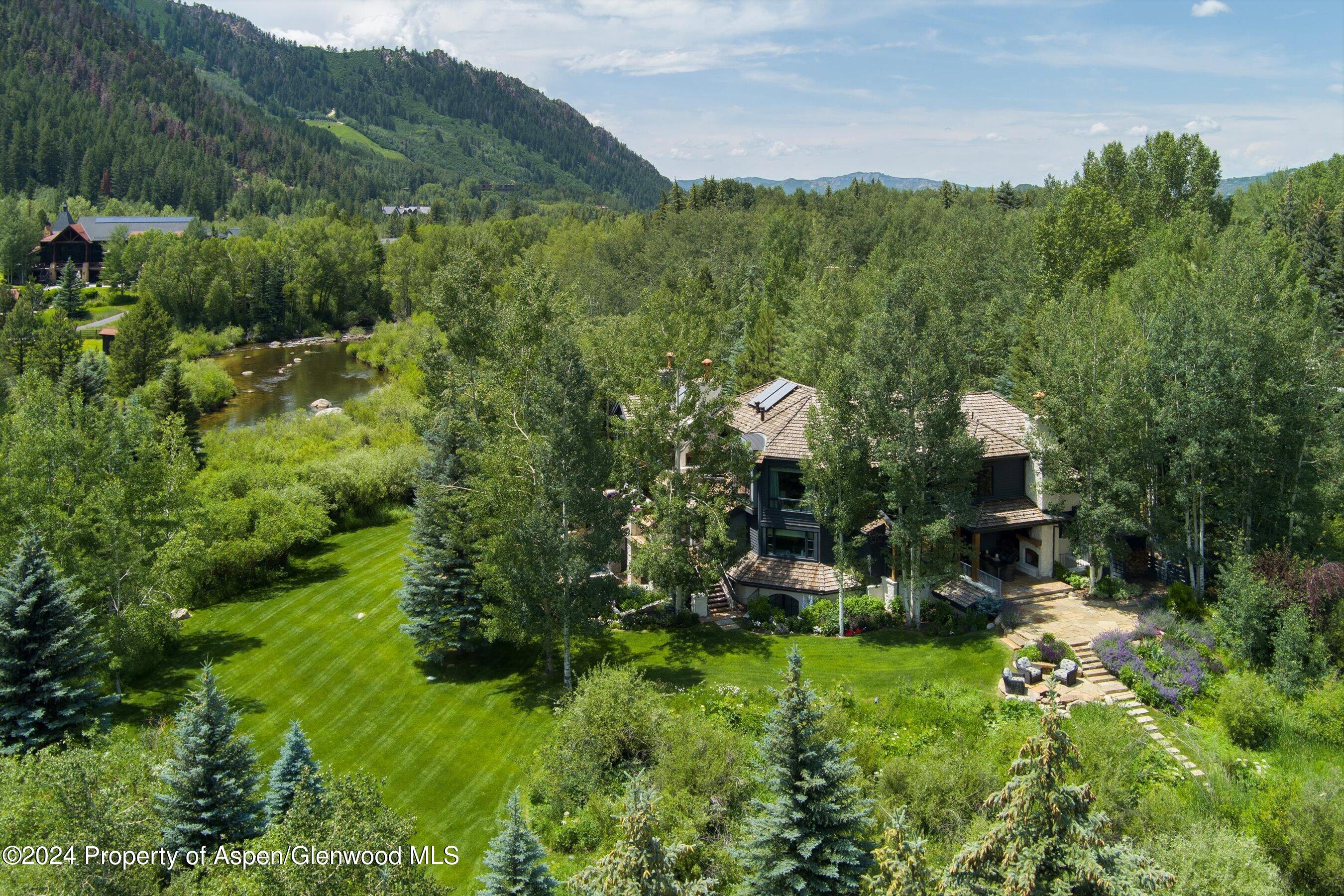1449 Crystal Lake Road Aspen, CO 81611 - Photo 6 of 82 a view of a city with lush green forest