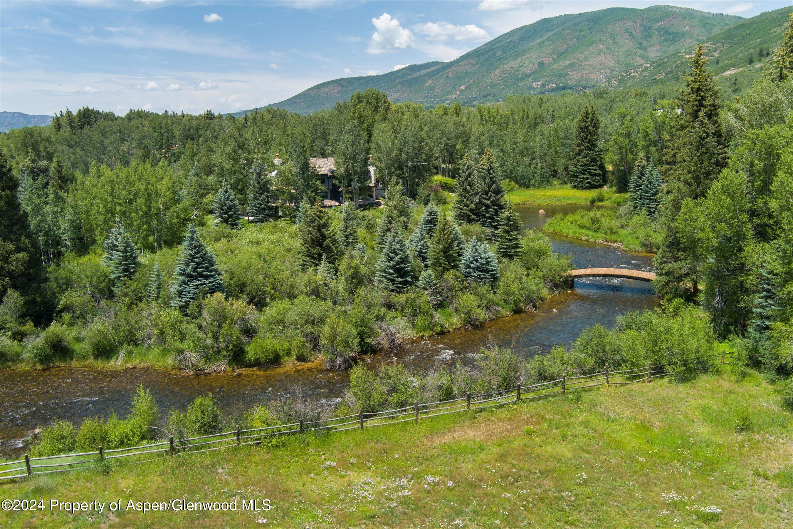 1449 Crystal Lake Road Aspen, CO 81611 - Photo 69 of 82 a view of a lake with a city