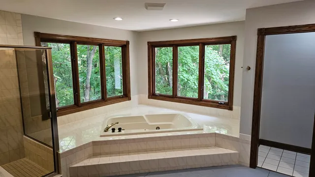 a bathroom with a double vanity sink and a toilet