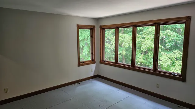 a bathroom with a toilet and a bathtub