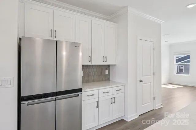 a white refrigerator freezer sitting in a kitchen