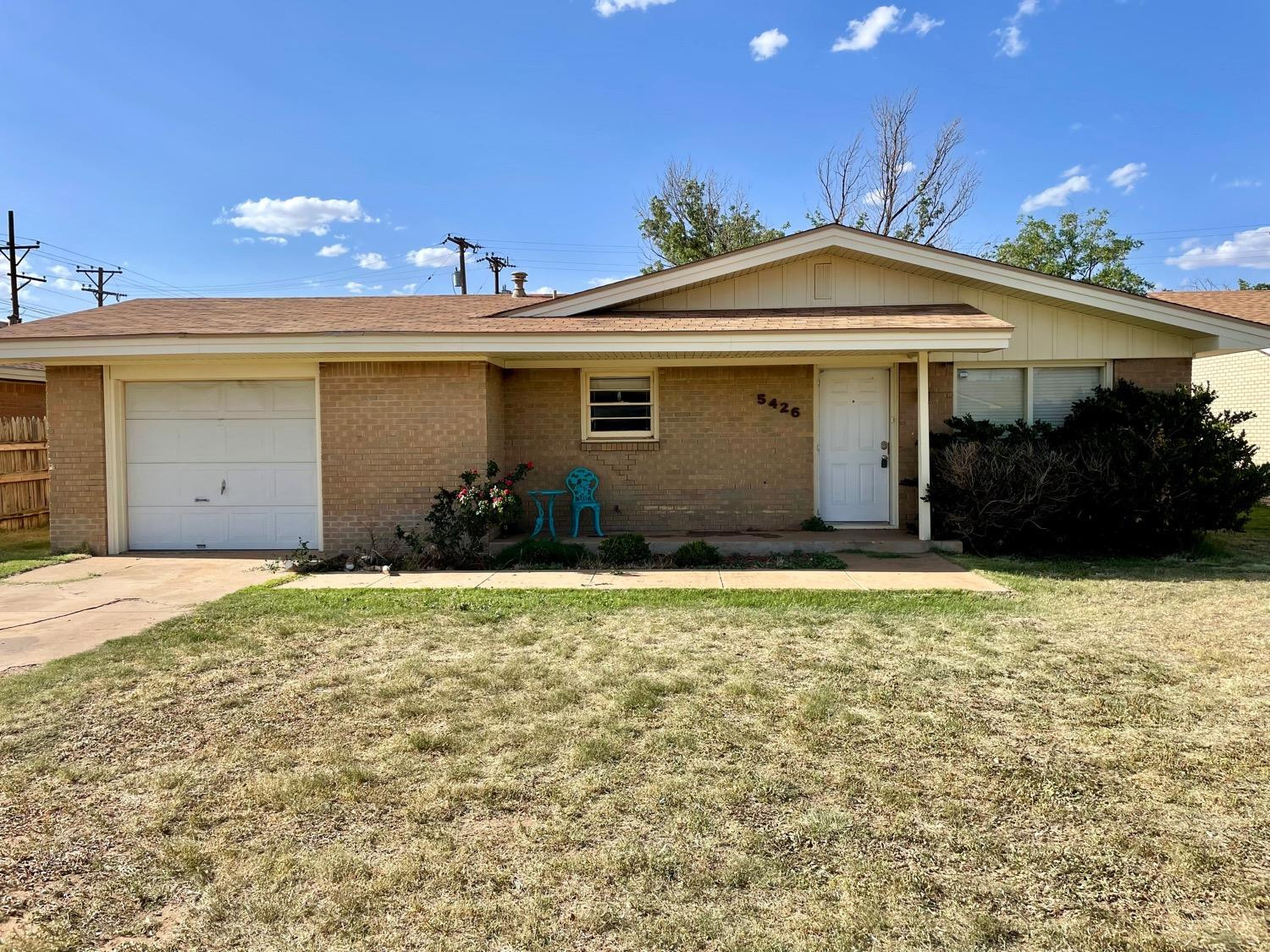 5426 25th Street Lubbock, TX 79407 - Photo 1 of 9 a front view of a house with garden