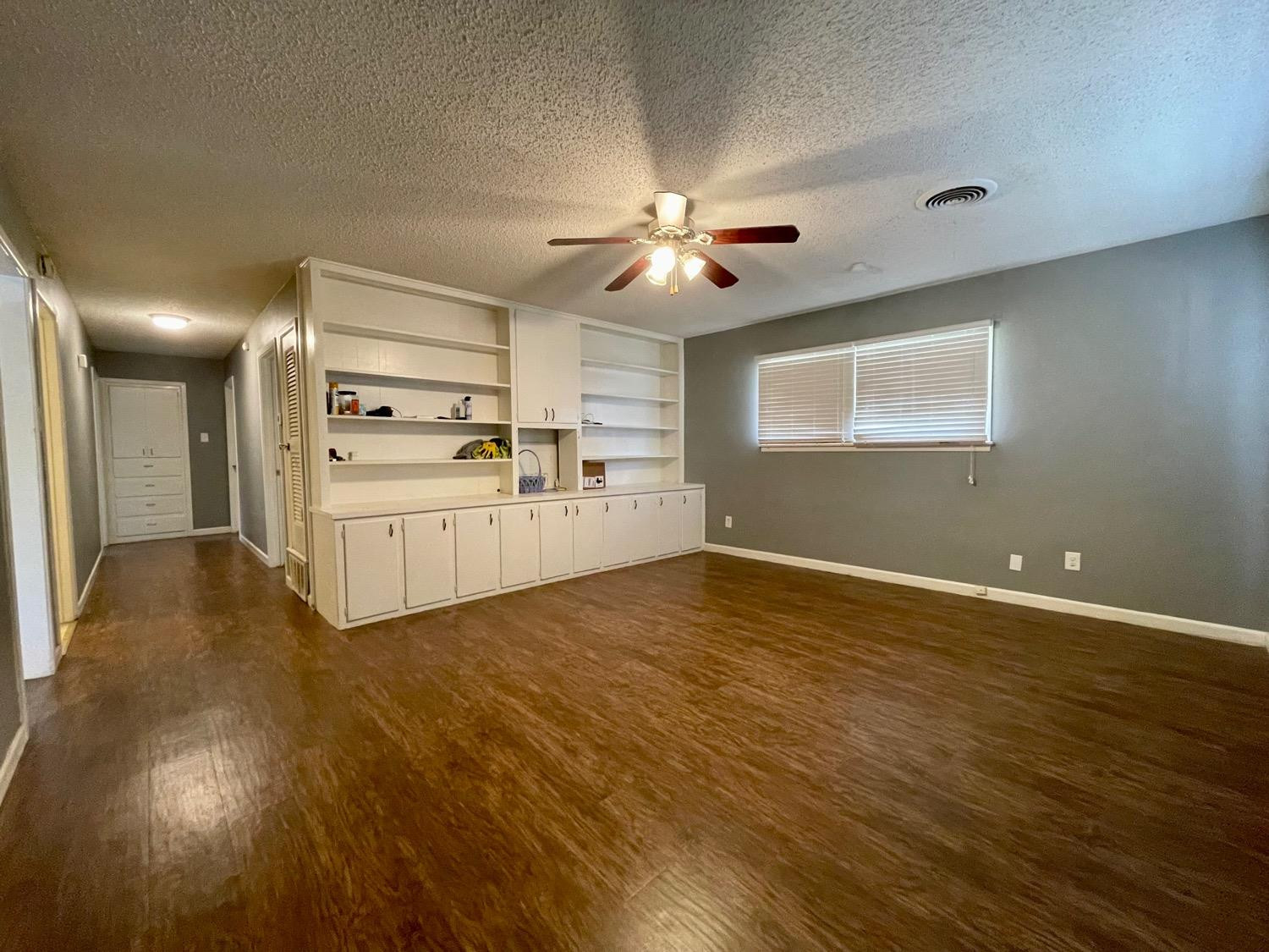5426 25th Street Lubbock, TX 79407 - Photo 3 of 9 a view of a livingroom with a kitchen