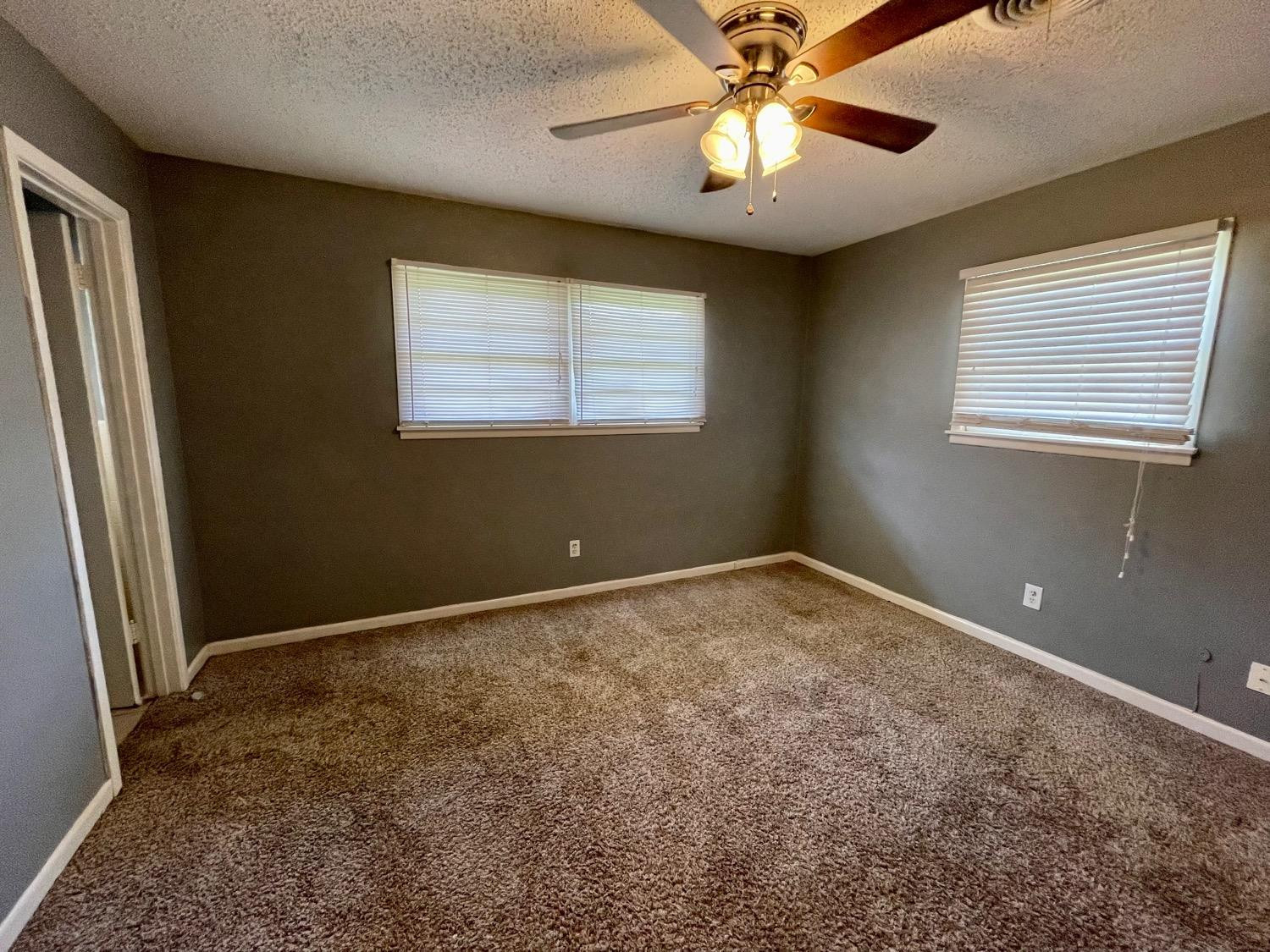 5426 25th Street Lubbock, TX 79407 - Photo 6 of 9 a view of an empty room with a window