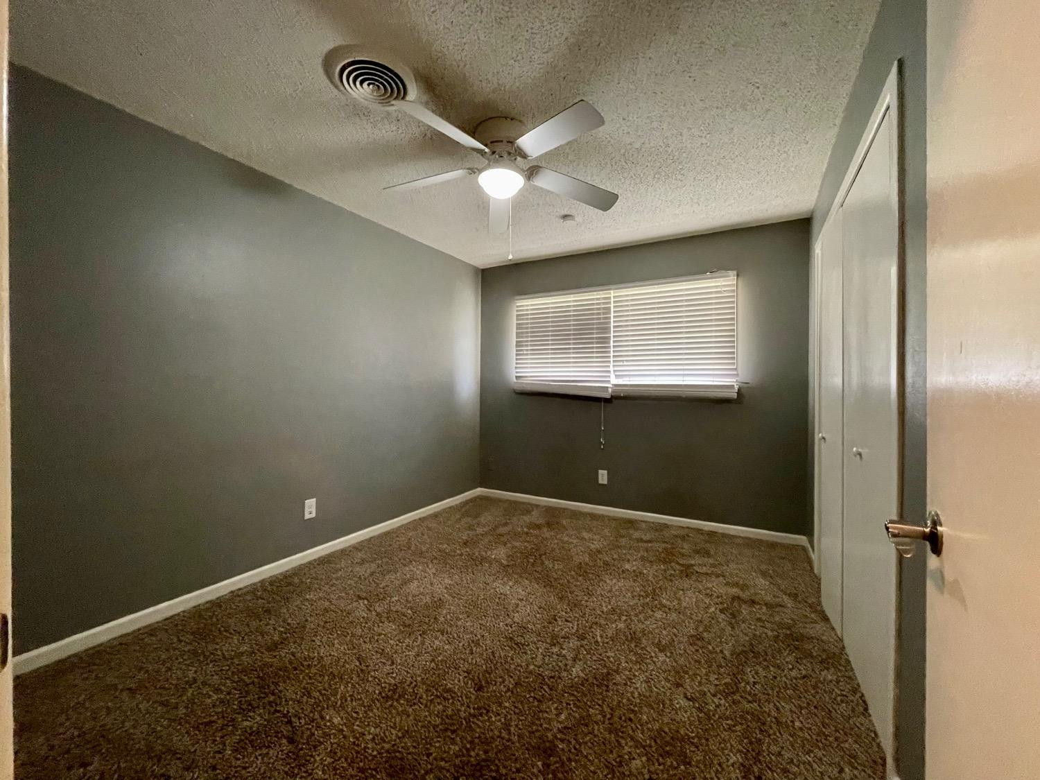 5426 25th Street Lubbock, TX 79407 - Photo 8 of 9 a view of an empty room and window