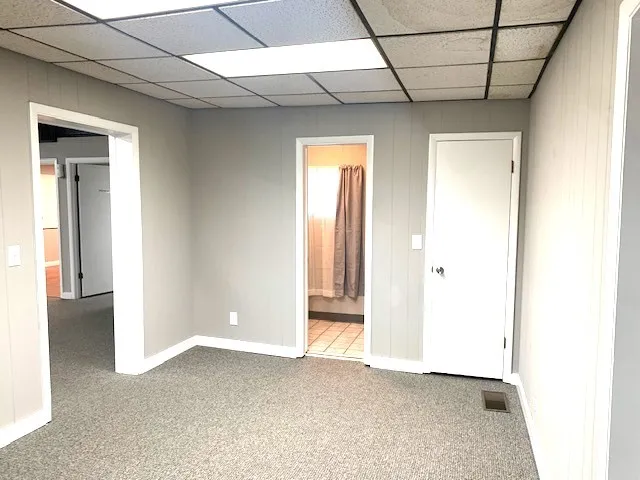 a view of an empty room and a window