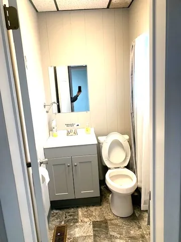 a view of a bathroom from a hallway