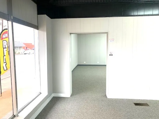 a view of an empty room with a window