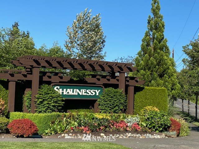 3719 154th Place Southeast Bothell, WA 98012 - Photo 2 of 37 a view of a sign board with flower plants