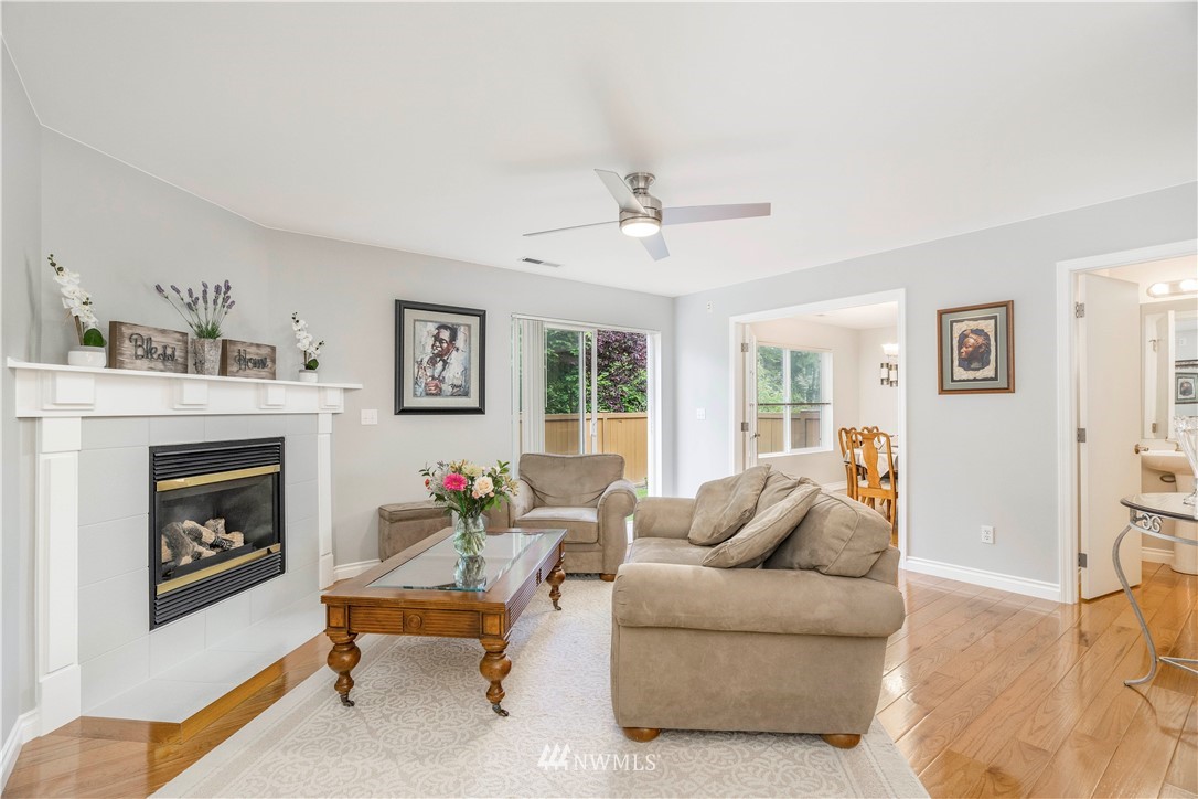 3719 154th Place Southeast Bothell, WA 98012 - Photo 11 of 37 a living room with furniture and a fireplace