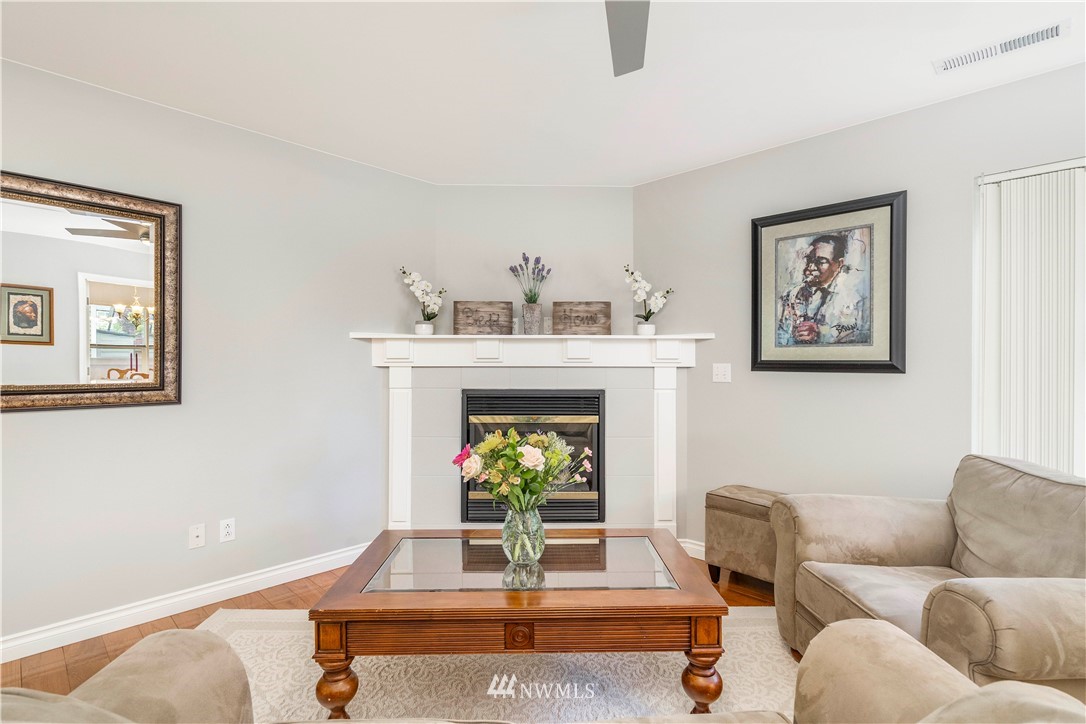 3719 154th Place Southeast Bothell, WA 98012 - Photo 12 of 37 a living room with furniture and a fireplace