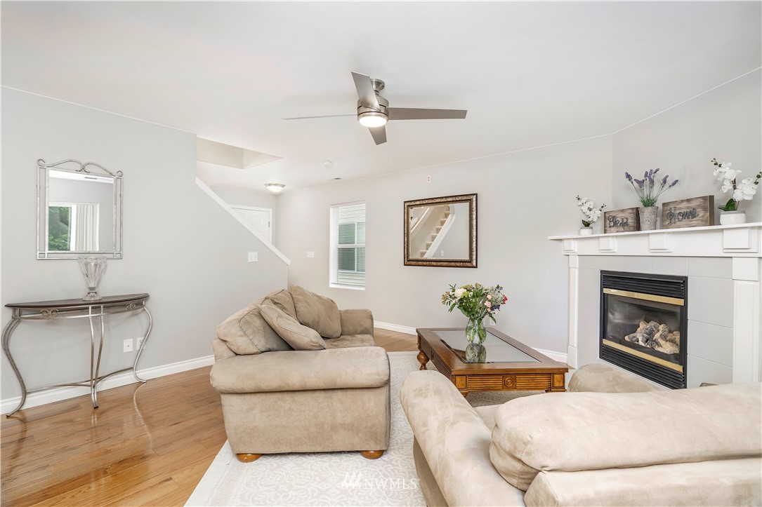 3719 154th Place Southeast Bothell, WA 98012 - Photo 14 of 37 a living room with furniture and a fireplace