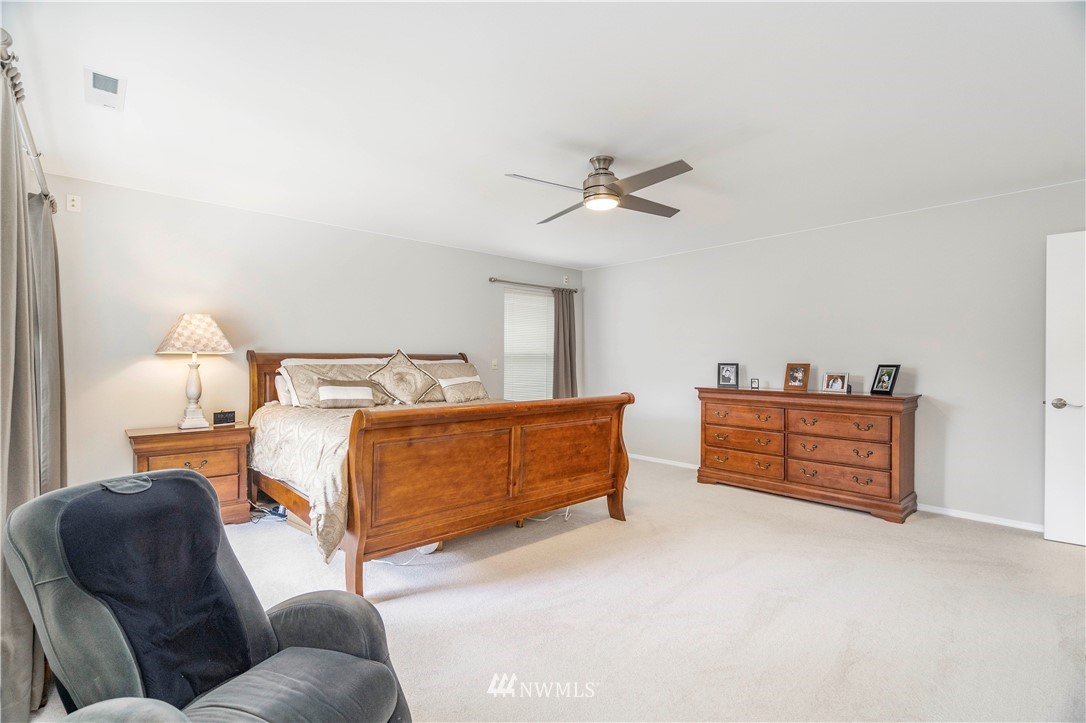 3719 154th Place Southeast Bothell, WA 98012 - Photo 18 of 37 a bedroom with furniture and a bed