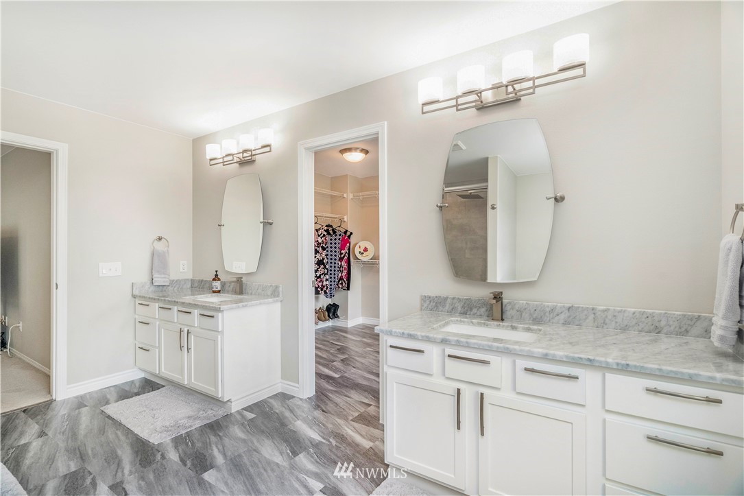 3719 154th Place Southeast Bothell, WA 98012 - Photo 19 of 37 a spacious bathroom with a granite countertop double vanity sink mirror and
