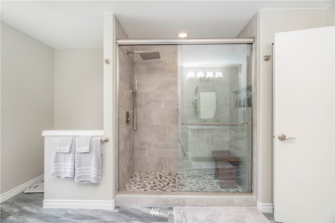 3719 154th Place Southeast Bothell, WA 98012 - Photo 20 of 37 a bathroom with a glass shower door