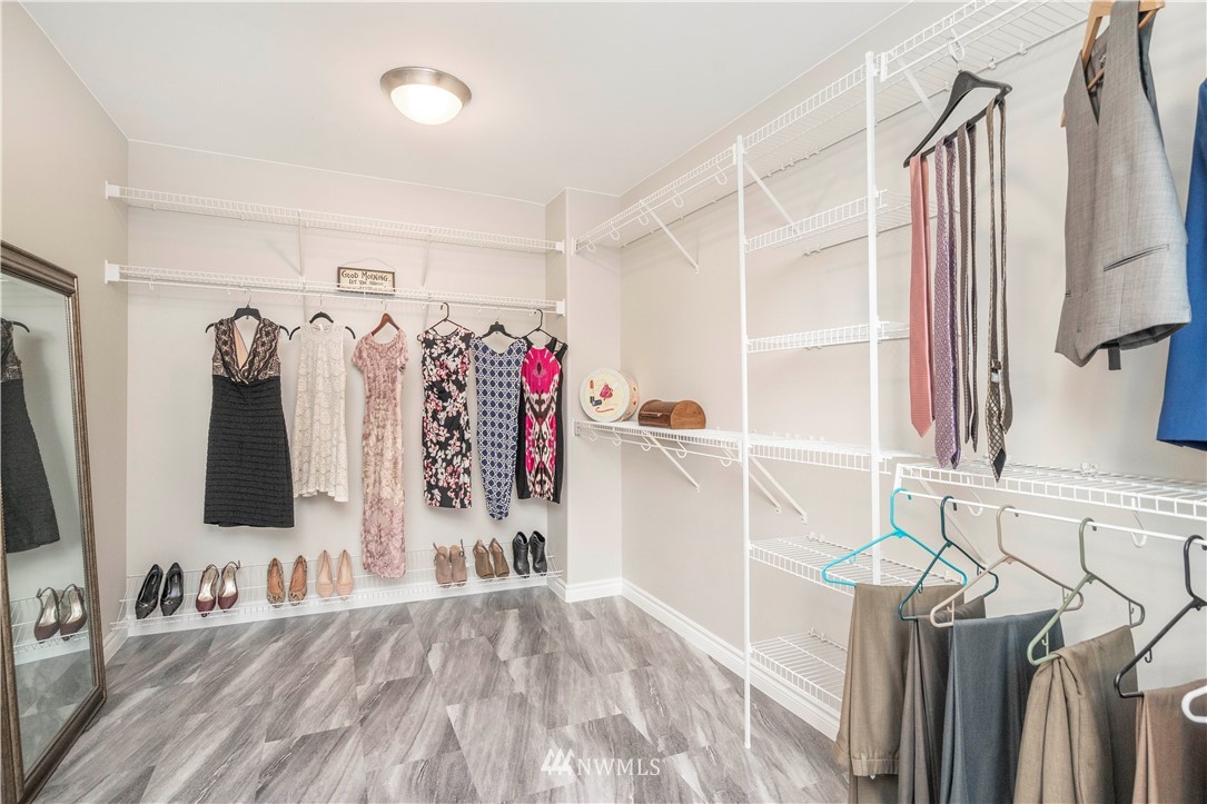 3719 154th Place Southeast Bothell, WA 98012 - Photo 21 of 37 a view of walk in closet with clothes and shoes